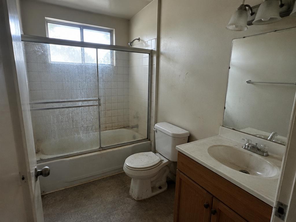 Rental bathroom before turnover, with dirty fixtures and surfaces